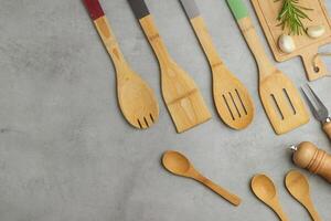Set of kitchen utensils on light gray background photo