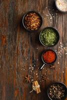 Various Spices on dark vintage background.. Top view photo