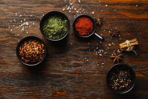 Various Spices on dark vintage background.. Top view photo