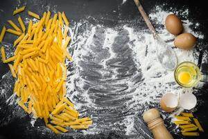 Dough preparation recipe bread, pizza, pasta or pie ingridients, food flat lay on kitchen table background. Working with butter, milk, yeast, flour, eggs, sugar pastry or bakery cooking photo