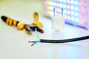 Electrical equipment connection. Core electric cable and light LED lamp photo