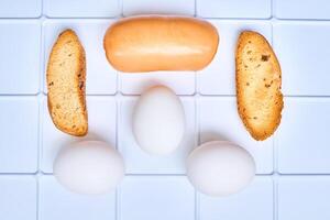 Simple delicious breakfast. Sausage, toasted bread, three eggs photo