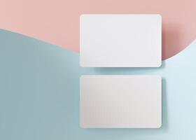 Two white business cards on pastel pink and blue, wavy background, perfect for a fresh and modern brand representation. European size, 3,25 x 2,17 inch. Visiting, name cards. Rounded corners. 3D. photo