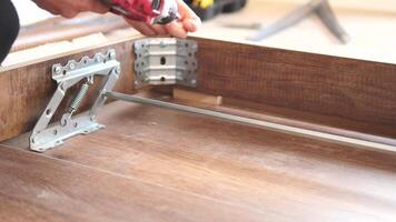 using electric drilling on wooden board video