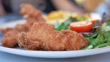 crispy coated fried chicken on a plate video