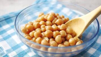 spoon pick Boiled chickpeas in a bowl video