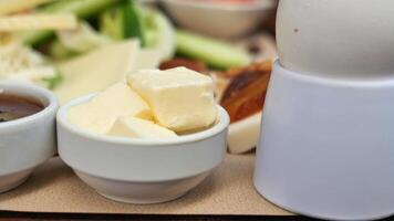 slice of fresh butter. egg and jelly on breakfast table video