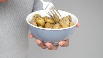 man holding a bowl of Turkish Grilled olives video