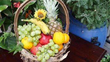 top view of mixed fruits in a bowl on table video