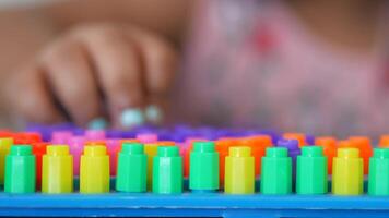 A little girl plays a game, developing motor skills and thinking video