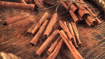 Super slow motion cinnamon sticks take off from a wooden table. On a wooden backgroundFilmed on a high-speed camera at 1000 fps. video