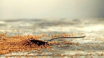 Super slow motion spoon with mustard falls on the table. On a gray background. Filmed on a high-speed camera at 1000 fps. video