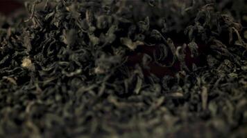 Super slow motion pieces of dry tea lift and fall down. Macro background. The texture of the tea. Filmed on a high-speed camera at 1000 fps. video