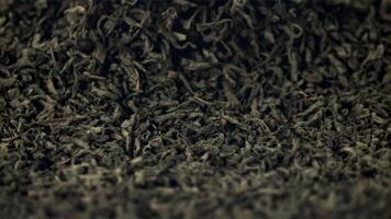 Super slow motion fragrant dry tea is tossed up. Macro background.Filmed on a high-speed camera at 1000 fps. video