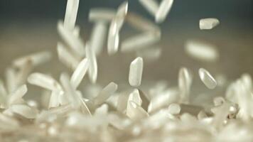 Falling rice grains. Filmed on a high-speed camera at 1000 fps. High quality FullHD footage video