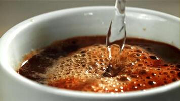 Boiling water is poured into the coffee. Filmed on a high-speed camera at 1000 fps. High quality FullHD footage video