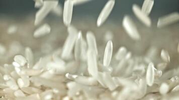 Falling rice grains. Filmed on a high-speed camera at 1000 fps. High quality FullHD footage video