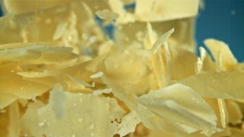 Parmesan cheese flies up and falls down. Filmed on a high-speed camera at 1000 fps. High quality FullHD footage video