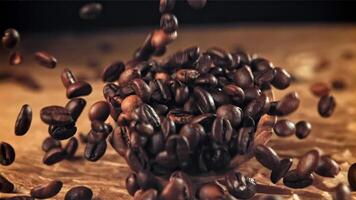 Coffee beans fall into a scoop. Filmed on a high-speed camera at 1000 fps. High quality FullHD footage video