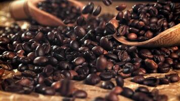 Coffee beans fall on the table. Filmed on a high-speed camera at 1000 fps. High quality FullHD footage video