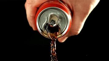 Cola pours from a tin can. High quality FullHD footage. Filmed is slow motion 1000 fps. video