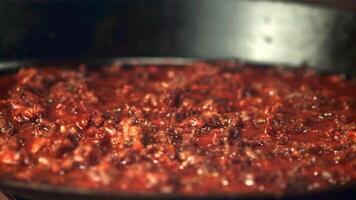 Super slow motion mince is fried in a frying pan. Filmed on a high-speed camera at 1000 fps.On a black background. video