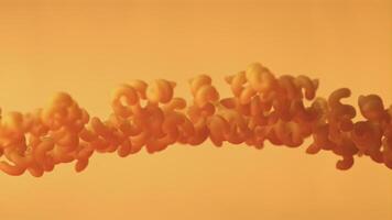 Super slow motion cavatappi paste dry. On an orange background.Filmed on a high-speed camera at 1000 fps. High quality FullHD footage video