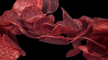 Sliced salami flies up and falls down. Filmed on a high-speed camera at 1000 fps. High quality FullHD footage video