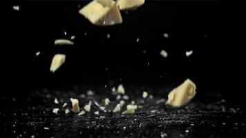 Chunks of white chocolate fall on the table. Filmed on a high-speed camera at 1000 fps. High quality FullHD footage video