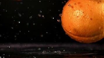 Oranges fall on the table. Filmed is slow motion 1000 fps. High quality FullHD footage video