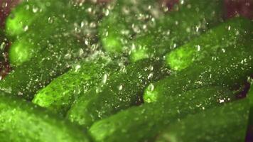 Super slow motion on the cucumbers drops water. Macro background. Filmed on a high-speed camera at 1000 fps. High quality FullHD footage video