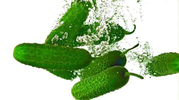 Super slow motion fresh cucumbers underwater with air bubbles. Filmed on a high-speed camera at 1000 fps.On a white background. High quality FullHD footage video