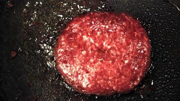 Super slow motion burger is fried in oil in a frying pan. Top view.Filmed on a high-speed camera at 1000 fps.High quality FullHD footage video