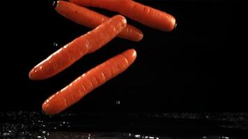Falling carrots on the table. Filmed is slow motion 1000 fps. High quality FullHD footage video