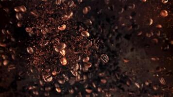 Roasted coffee beans in flight. Filmed on a high-speed camera at 1000 fps. High quality FullHD footage video