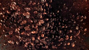 Roasted coffee beans in flight. Filmed on a high-speed camera at 1000 fps. High quality FullHD footage video