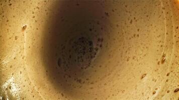 Foam with black coffee. Top view. Filmed on a high-speed camera at 1000 fps. High quality FullHD footage video