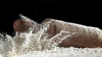 The rolling pin falls into the flour. Filmed on a high-speed camera at 1000 fps. High quality FullHD footage video