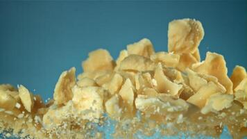 Parmesan cheese flies up and falls down. Filmed on a high-speed camera at 1000 fps. High quality FullHD footage video