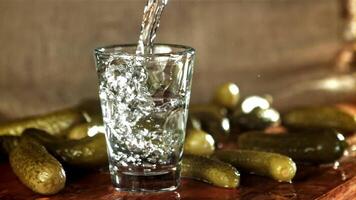 Vodka is poured into a glass. Filmed on a high-speed camera at 1000 fps. High quality FullHD footage video