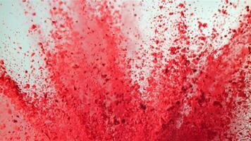 Super slow motion explosion of colored powder on white background. Filmed on a high-speed camera at 1000 fps. High quality FullHD footage video