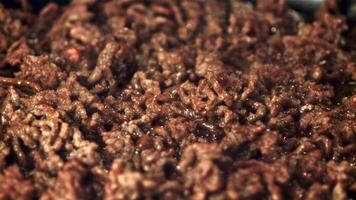 Super slow motion minced meat is fried with bubbles of oil. Macro background. Filmed on a high-speed camera at 1000 fps. video