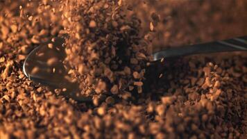 Super slow motion spoon falls into a pile of instant coffee. Macro background.Filmed on a high-speed camera at 1000 fps. video