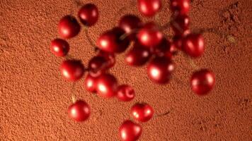 Super slow motion fresh cherry falls on the cocoa powder. On a brown background. Top view. Filmed on a high-speed camera at 1000 fps. video