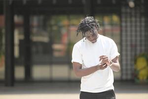 A young man with his hairstyle and the atmosphere of living in the community. photo