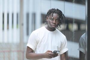 A young man with his hairstyle and the atmosphere of living in the community. photo