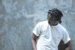 A young man with his hairstyle and the atmosphere of living in the community. photo