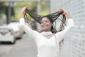 A young woman with his hairstyle and the atmosphere of living in the community. photo