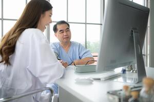 Doctor using a blood pressure monitor on a patient photo