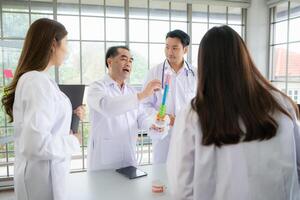 A medical professor is lecturing on a case study related to disease treatment to medical students photo